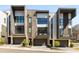 Contemporary townhomes showcasing a blend of stone, siding, and stucco with private balconies at 103 Birch St, Decatur, GA 30030