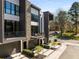 Modern townhouse with stone accents, balconies, and professional landscaping at 103 Birch St, Decatur, GA 30030