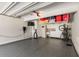 Spacious garage with epoxy floor, storage racks, cabinets, and an electric vehicle charger for convenience at 103 Birch St, Decatur, GA 30030