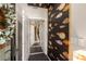 Hallway with dark hardwood floors, colorful fish wallpaper, white trim, and access to stairs and an elevator at 103 Birch St, Decatur, GA 30030