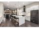 Modern kitchen with a large island, stainless steel appliances, and hardwood flooring throughout at 103 Birch St, Decatur, GA 30030
