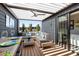 Covered deck with ceiling fan, cushioned outdoor seating, and dining table with place settings at 103 Birch St, Decatur, GA 30030