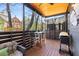 Relaxing screened porch with wood ceiling includes outdoor dining and a grill, perfect for entertaining at 103 Birch St, Decatur, GA 30030