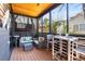 Inviting screened porch with wood ceiling features a seating area and dining space with open views at 103 Birch St, Decatur, GA 30030