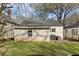 Backyard featuring a well-maintained lawn, patio area, and convenient access to the home's exterior at 1277 Mcpherson Se Ave, Atlanta, GA 30316