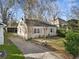 Quaint house with driveway and inviting curb appeal surrounded by lush greenery at 1277 Mcpherson Se Ave, Atlanta, GA 30316