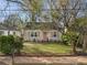 Charming single-story home with a well-manicured lawn and a coral-colored front door at 1277 Mcpherson Se Ave, Atlanta, GA 30316