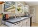 Close-up view of the kitchen sink and counter with double windows providing natural light at 1277 Mcpherson Se Ave, Atlanta, GA 30316