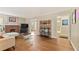 Bright living room with hardwood floors, a brick fireplace, and large windows with lots of natural light at 1277 Mcpherson Se Ave, Atlanta, GA 30316
