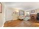 Bright living room features hardwood floors, stylish furnishings, and a charming brick fireplace at 1277 Mcpherson Se Ave, Atlanta, GA 30316