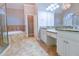 Elegant bathroom with a large vanity, granite countertop, and a separate shower at 912 Fire Thorn Dr, Hampton, GA 30228