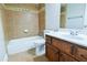 Bathroom with a combination shower and tub, and a wood vanity at 912 Fire Thorn Dr, Hampton, GA 30228
