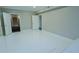 Bright bedroom featuring a white tile floor, neutral walls, and two doorways at 912 Fire Thorn Dr, Hampton, GA 30228