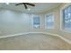Spacious bedroom with neutral walls, carpet, and large windows at 912 Fire Thorn Dr, Hampton, GA 30228