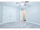 Bright bedroom with closet, soft carpet, and neutral paint at 912 Fire Thorn Dr, Hampton, GA 30228