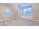 Spacious bedroom featuring two bright windows and built-in storage at 912 Fire Thorn Dr, Hampton, GA 30228