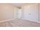 Neutral bedroom featuring multiple closets and plush carpeting at 912 Fire Thorn Dr, Hampton, GA 30228