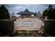 Stone sign for Crystal Lake Golf and Country Club nestled in a landscaped setting at 912 Fire Thorn Dr, Hampton, GA 30228