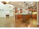 Gourmet kitchen featuring stainless steel appliances, a central island, and dark wood cabinetry at 912 Fire Thorn Dr, Hampton, GA 30228