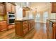 Well appointed kitchen with stainless appliances, granite counters, and a large center island cooktop at 912 Fire Thorn Dr, Hampton, GA 30228