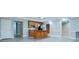 Modern kitchen with stainless steel appliances, wood cabinets, granite countertops, and island at 912 Fire Thorn Dr, Hampton, GA 30228