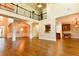 Open-concept living area with dark hardwood floors, and abundant natural light, perfect for entertaining at 912 Fire Thorn Dr, Hampton, GA 30228