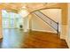 Spacious living room featuring hardwood floors, a fireplace, and built-in shelving at 912 Fire Thorn Dr, Hampton, GA 30228
