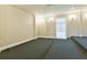 Spacious carpeted room with bright recessed lighting and neutral paint at 912 Fire Thorn Dr, Hampton, GA 30228