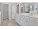 Elegant main bathroom with double vanity sinks and a large mirror at 217 Groveton Ct, Euharlee, GA 30145