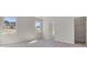 Spacious main bedroom with natural light from the windows and walk-in closet at 217 Groveton Ct, Euharlee, GA 30145