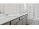 Bathroom featuring a double vanity with gray cabinets and a shower with sliding glass doors at 313 Skye Ln # 49, Cartersville, GA 30121