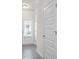 Bright hallway with plank flooring and paneled doors at 313 Skye Ln # 49, Cartersville, GA 30121