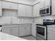 Kitchen featuring stainless steel appliances, light grey cabinets and granite counters at 313 Skye Ln # 49, Cartersville, GA 30121