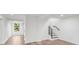 Finished basement features wood-look floors, recessed lighting, and access to backyard at 3951 Covered Bridge Sw Rd, Smyrna, GA 30082