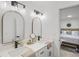 Modern bathroom boasts double sinks with matte black fixtures and decor, and includes views to the primary bedroom at 3951 Covered Bridge Sw Rd, Smyrna, GA 30082