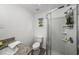 Cozy bathroom featuring a granite-look vanity, a shower with a glass door, and wood-look flooring at 3951 Covered Bridge Sw Rd, Smyrna, GA 30082