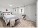 Comfortable bedroom with a queen bed, neutral carpet, and light-blocking curtains at 3951 Covered Bridge Sw Rd, Smyrna, GA 30082