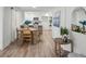 Cozy dining area featuring a round table, comfortable chairs, and bright natural light at 3951 Covered Bridge Sw Rd, Smyrna, GA 30082