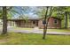 Charming single-story home featuring a covered parking area and a well-maintained front yard at 3951 Covered Bridge Sw Rd, Smyrna, GA 30082