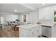 Modern kitchen with white cabinetry, stainless steel appliances, open layout connecting to living areas at 3951 Covered Bridge Sw Rd, Smyrna, GA 30082