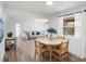 Open-concept living space with dining area and seating, filled with natural light and modern finishes at 3951 Covered Bridge Sw Rd, Smyrna, GA 30082