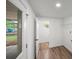 Light-filled mud room with neutral paint, door to backyard and vinyl flooring at 3951 Covered Bridge Sw Rd, Smyrna, GA 30082