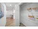 Bright pantry with white wire shelving and decorative baskets and view into breakfast nook at 3951 Covered Bridge Sw Rd, Smyrna, GA 30082