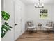 Cozy sitting area with comfortable chairs, modern lighting, and a view of the outdoor greenery at 3951 Covered Bridge Sw Rd, Smyrna, GA 30082