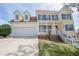 Beautiful two-story home featuring a covered front porch and a two-car garage at 401 Bradford Way, Auburn, GA 30011