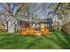 Charming home featuring a spacious wooden deck and a lush, green lawn, perfect for outdoor enjoyment at 4179 Hanes Dr, Decatur, GA 30035