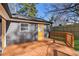 Backyard deck with a view of fenced yard and house with a yellow door at 4179 Hanes Dr, Decatur, GA 30035