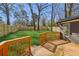 Wooden deck overlooks a well-maintained lawn and a wood fence at 4179 Hanes Dr, Decatur, GA 30035