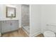 Bathroom featuring tiled stand up shower and white quartz countertops at 4179 Hanes Dr, Decatur, GA 30035