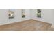 Bright bedroom with natural light, featuring light wood floors and fresh white paint at 4179 Hanes Dr, Decatur, GA 30035